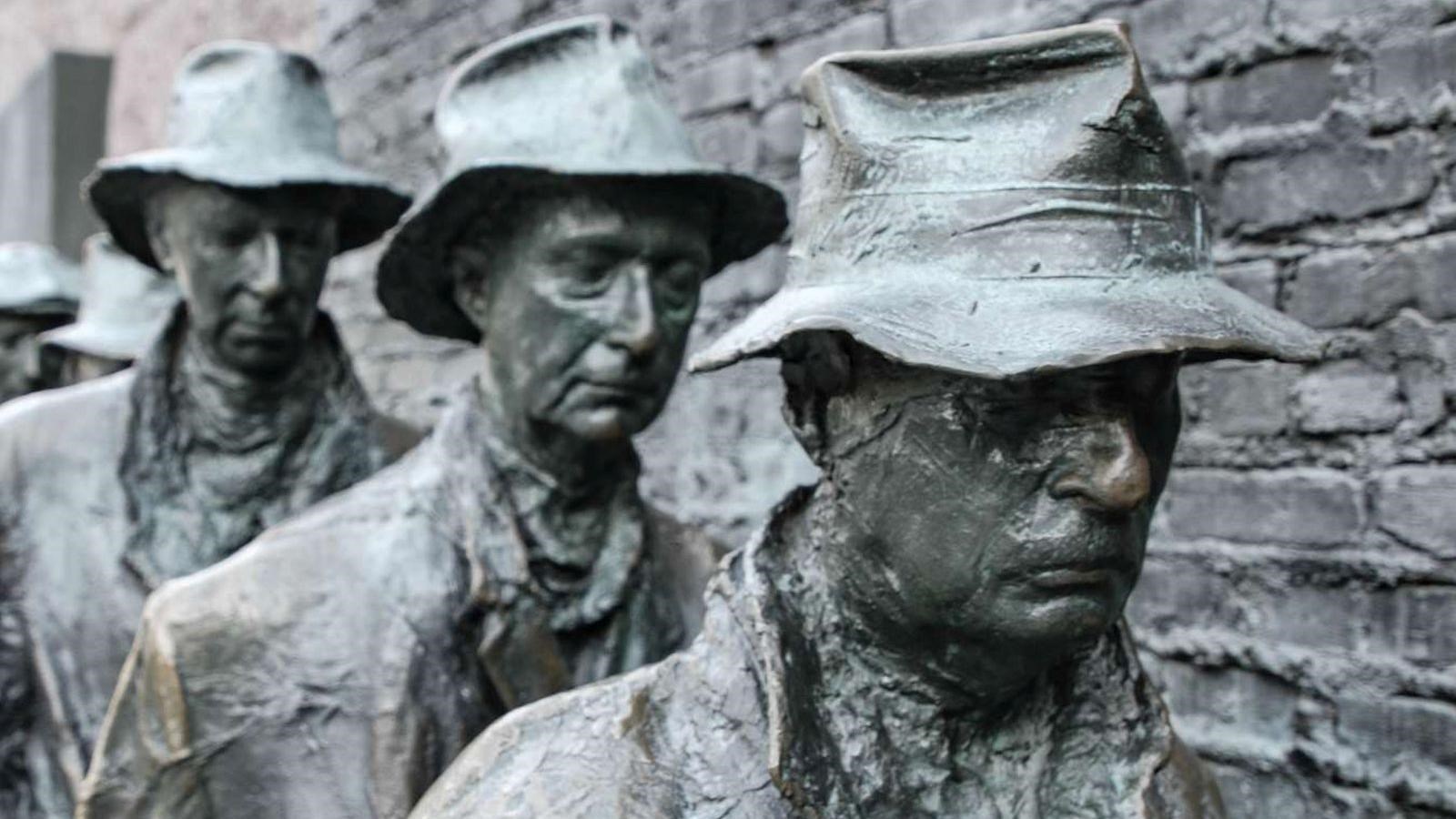 Statues of three men in bread line