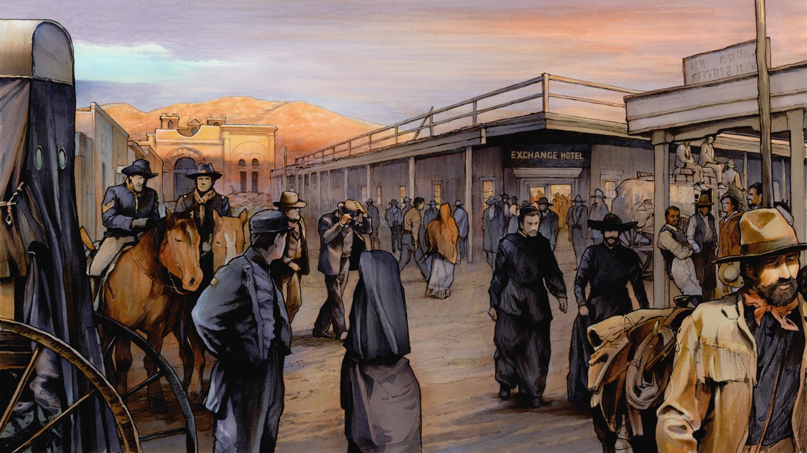 People move around a historic city with adobe buildings.