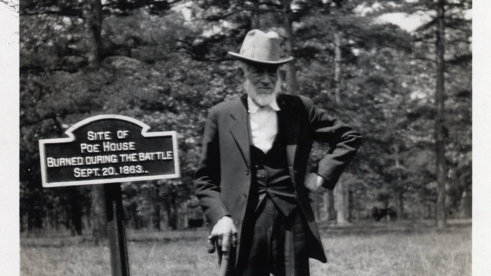 Larkin Poe stands at his old house site