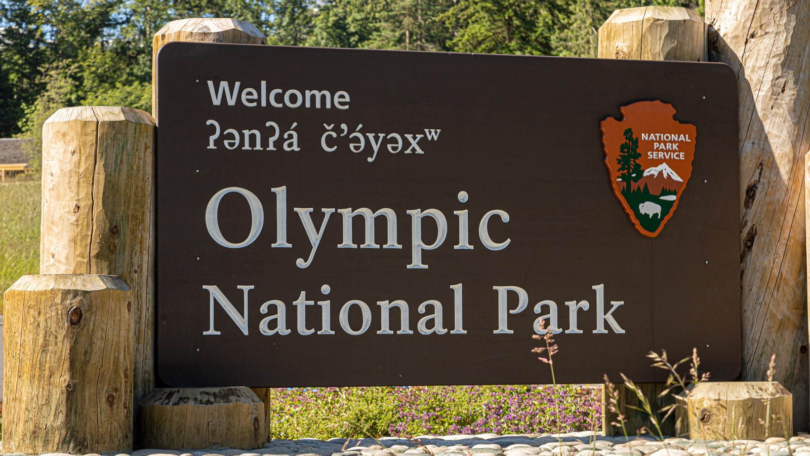 Sign with the arrowhead logo that reads
