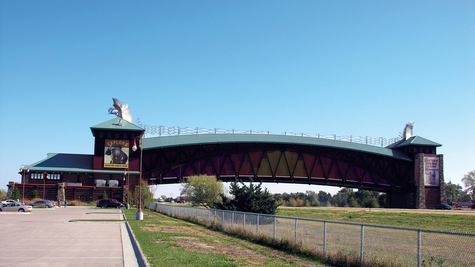 An expansive pedestrian bridge over a highway.