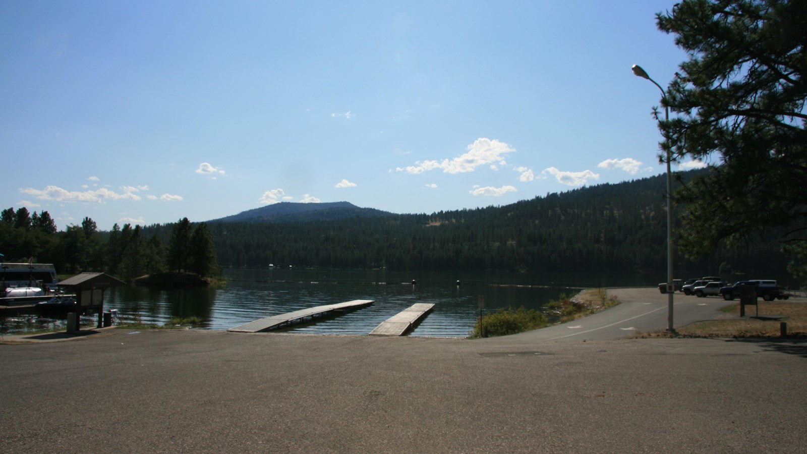 A paved boat launch with two docks is accessible from the parking area.