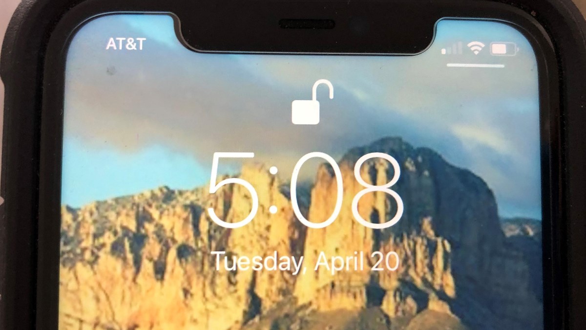 The lock screen of a cell phone displaying the time