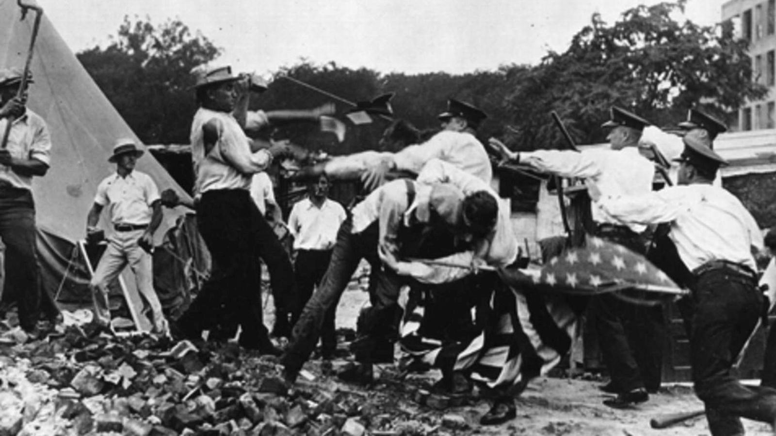 A group of men armed with bricks and pipes fights with a group of police armed with nightsticks. One