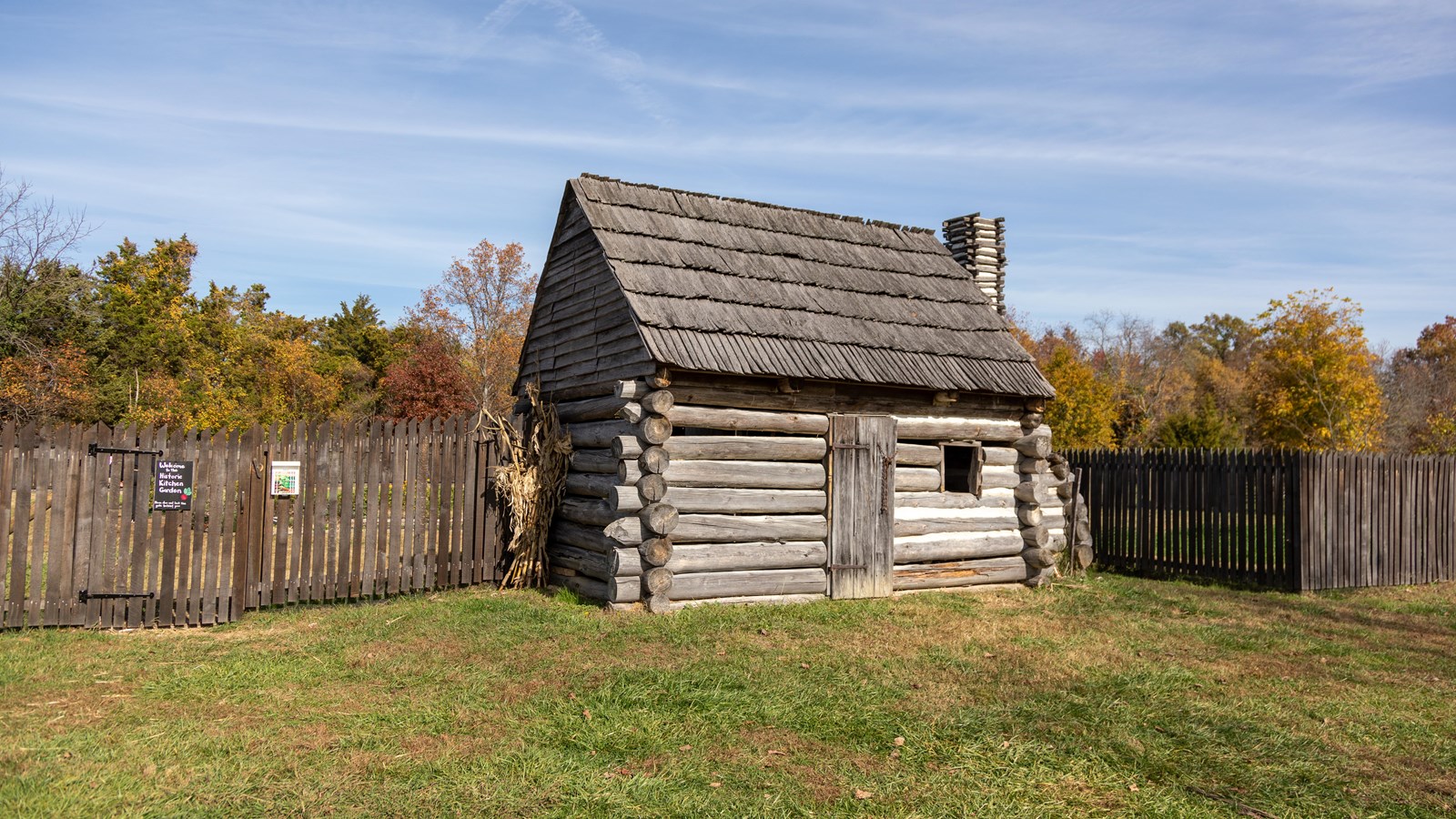 A small wooden building with a garden