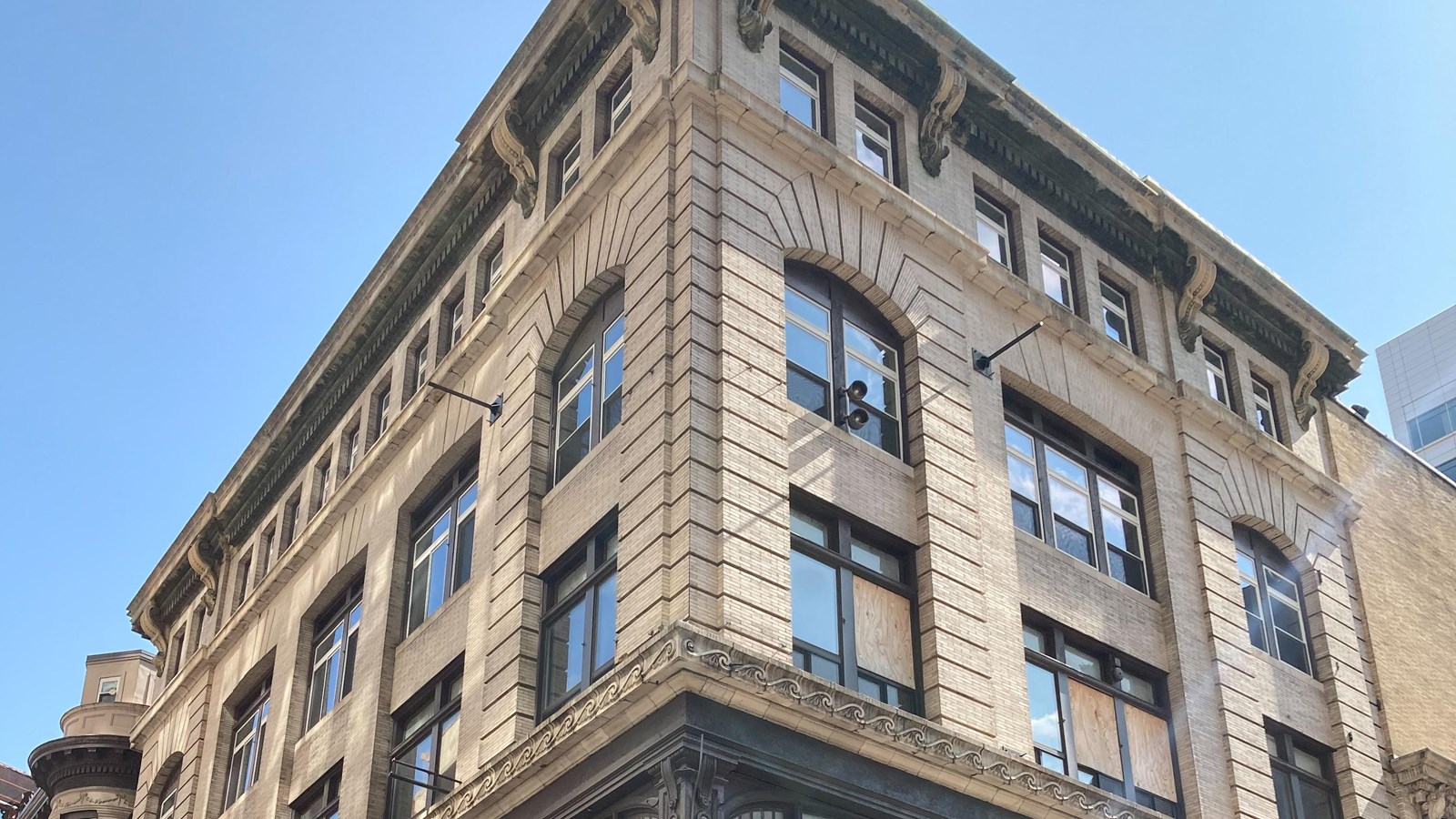 The top two floors of a neo-classical designed building.