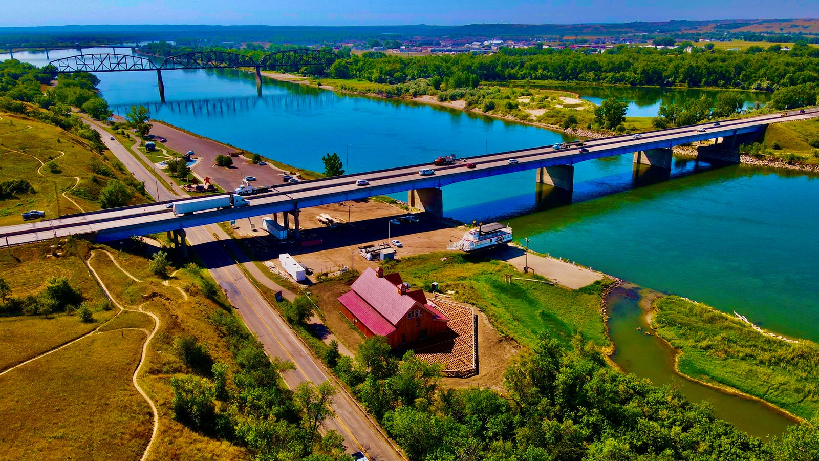 Visitor Center on the banks of the Missouri River with historic bridge