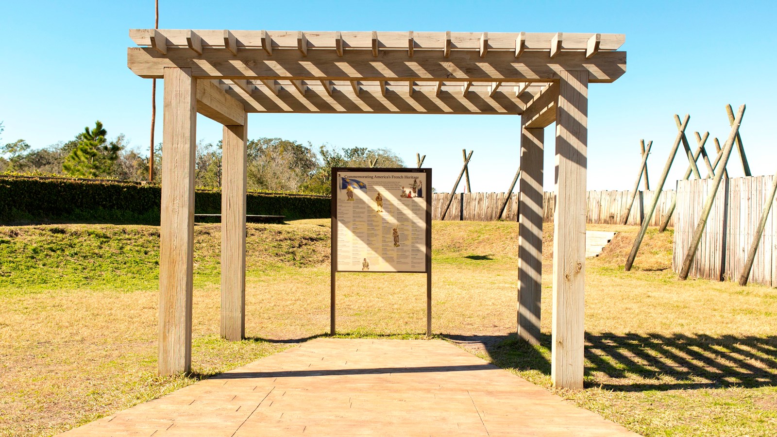 an upright panel under a pergola in a wooden fort