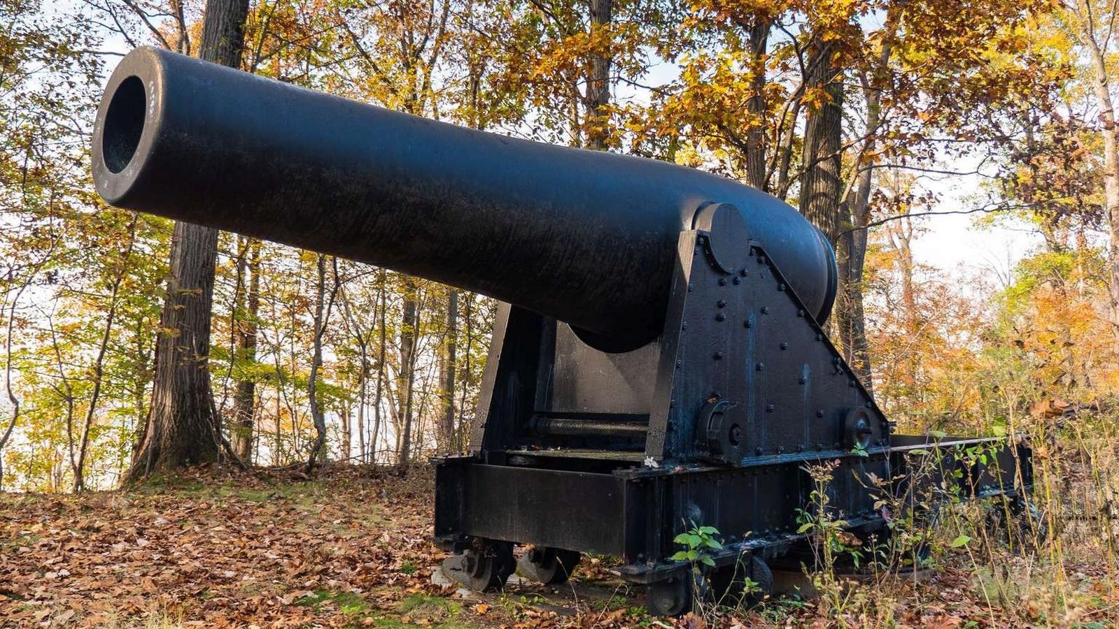 A large 15-inch Rodman Cannon stands among several trees at Fort Foote.