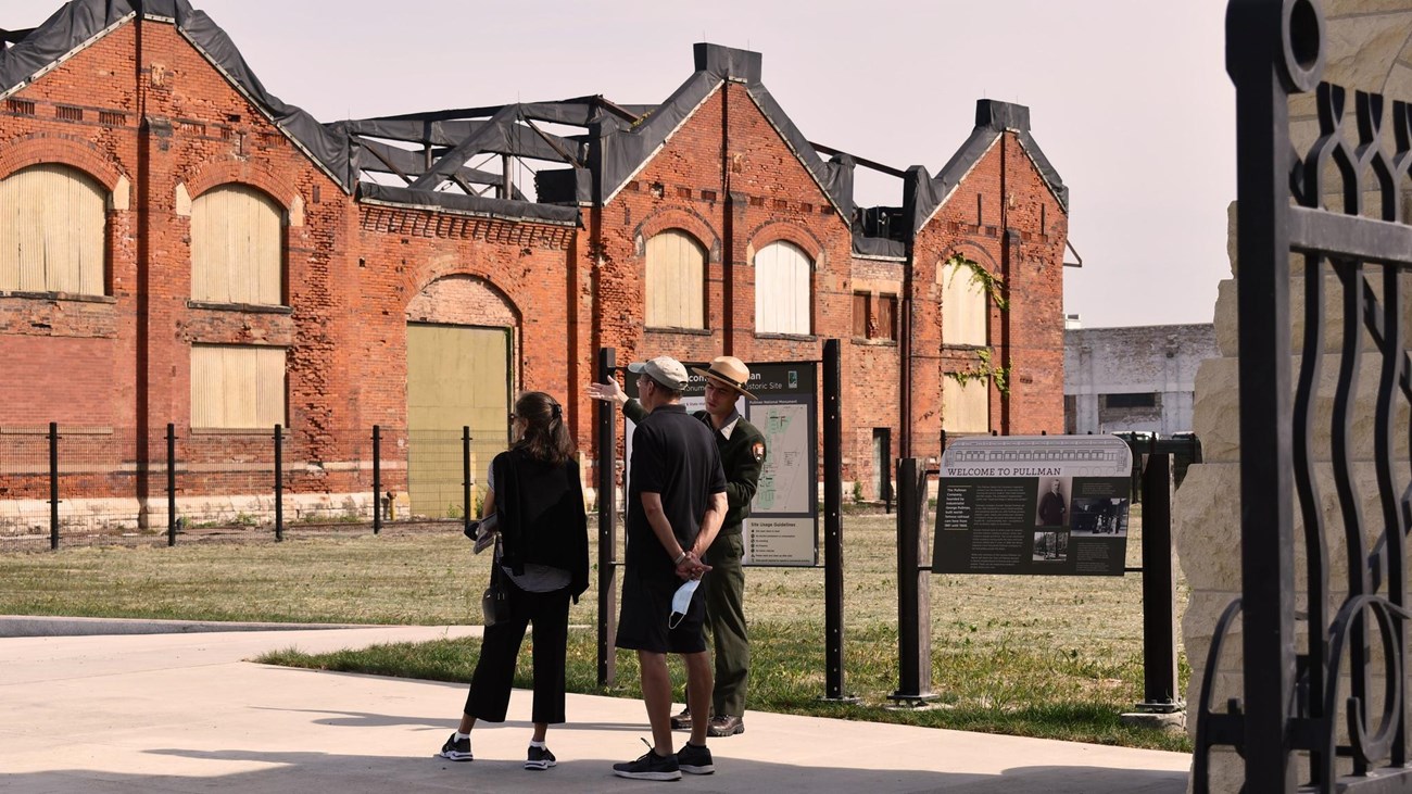 An NPS Ranger leads a tour of the Pullman Factory Grounds