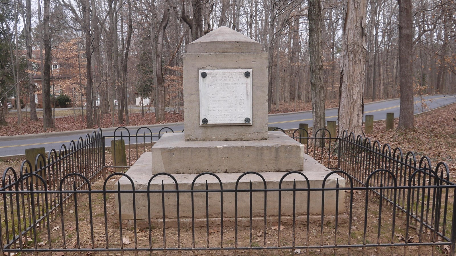 A multi layered cenotaph. The monument appears as a square stone atop multiple layers of a base.