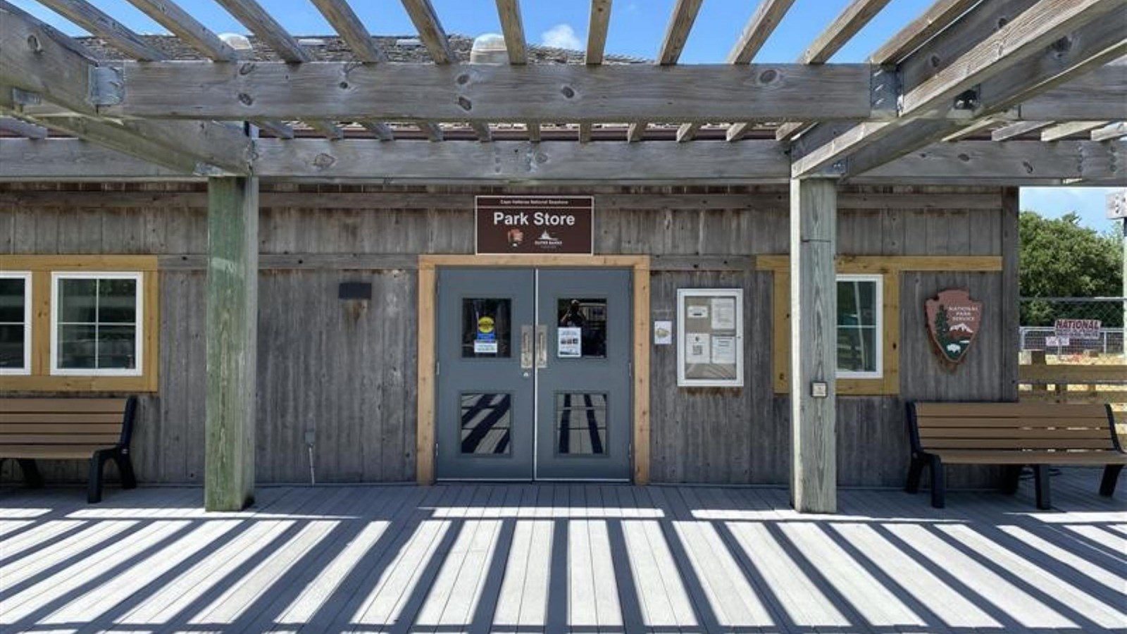 Wooden building with two double doors at center.