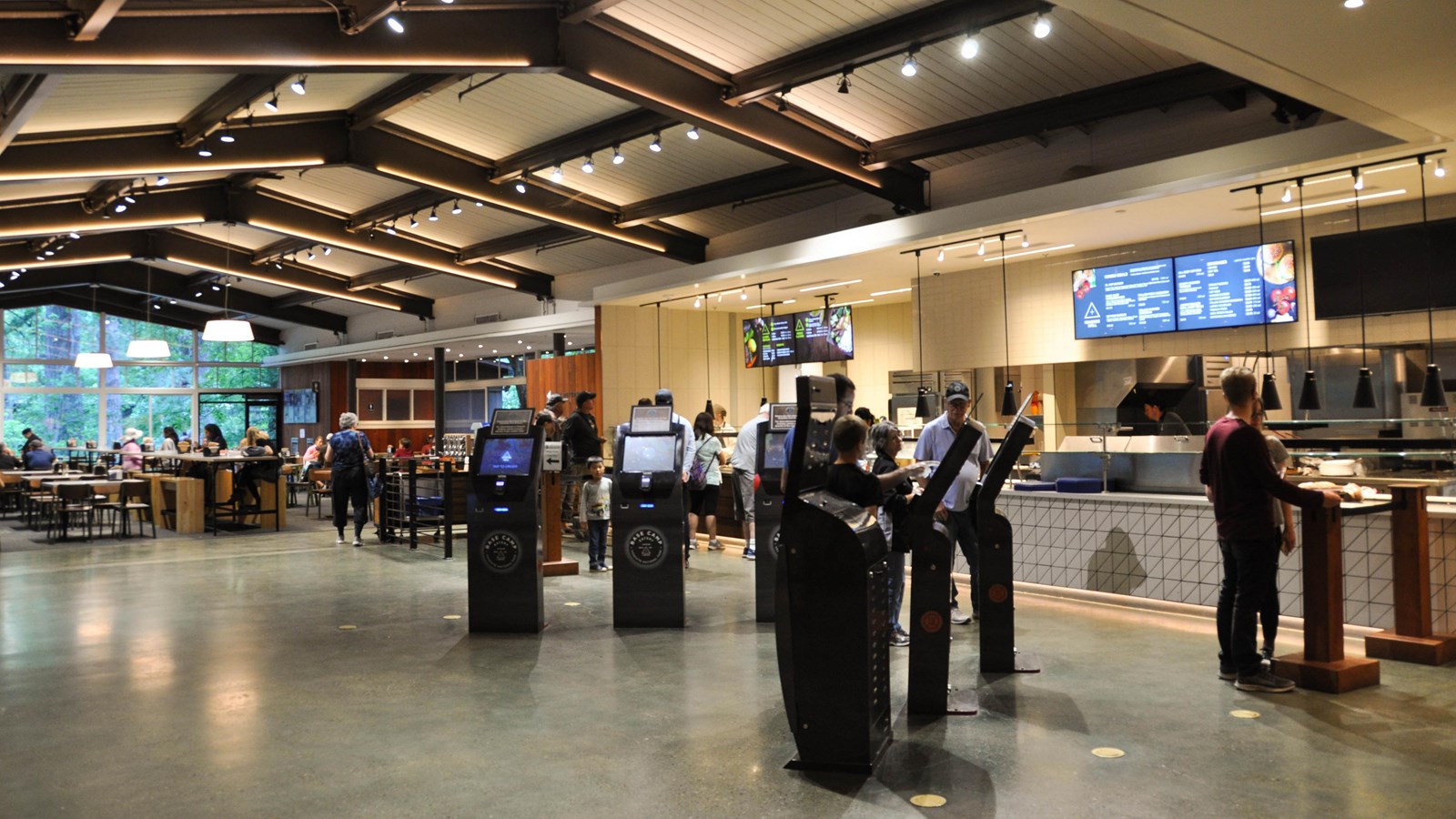 Interior of Base Camp Eatery with person ordering at kiosk