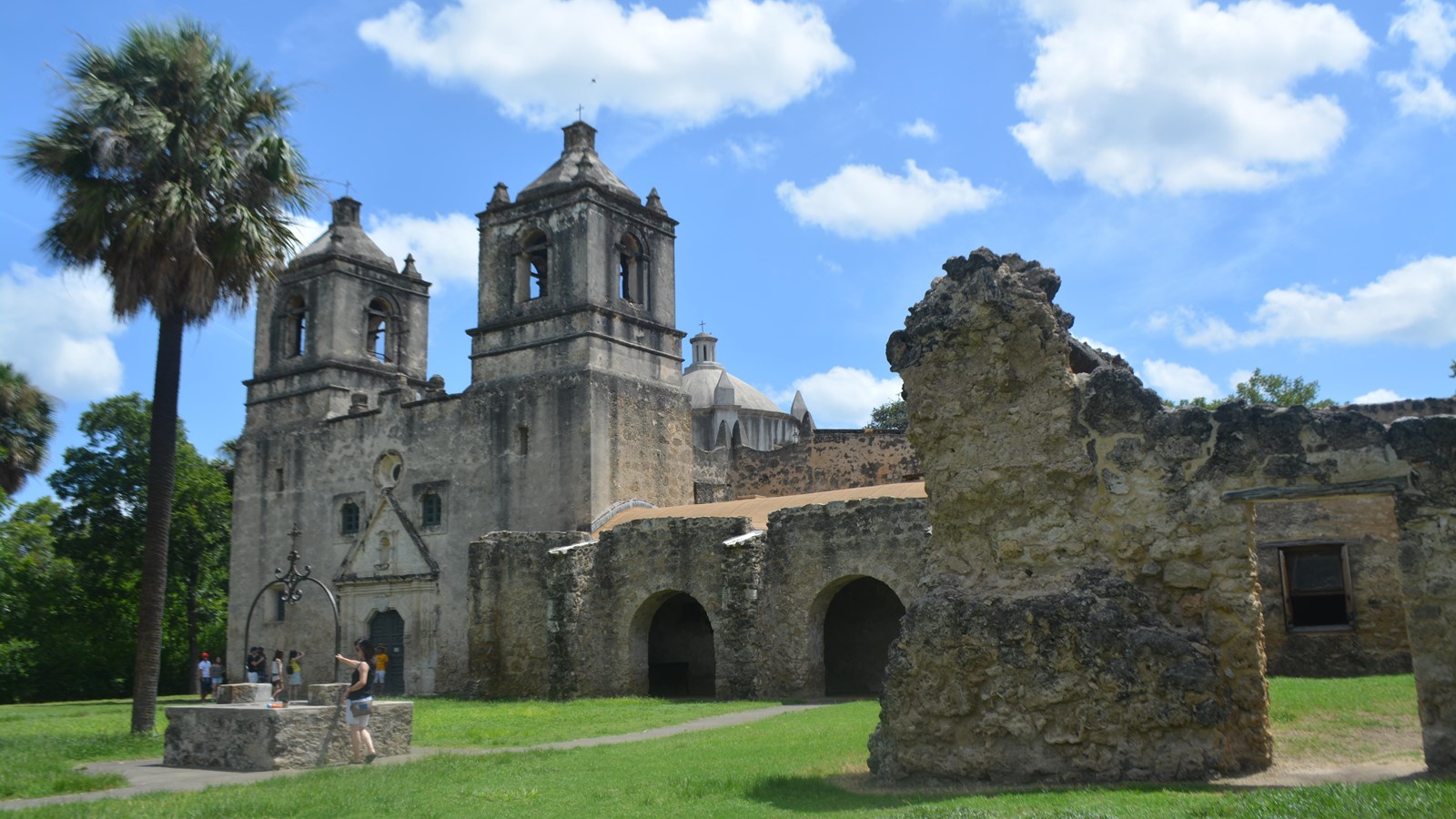 Mission Concepcion grounds with church, convento, and water well. 