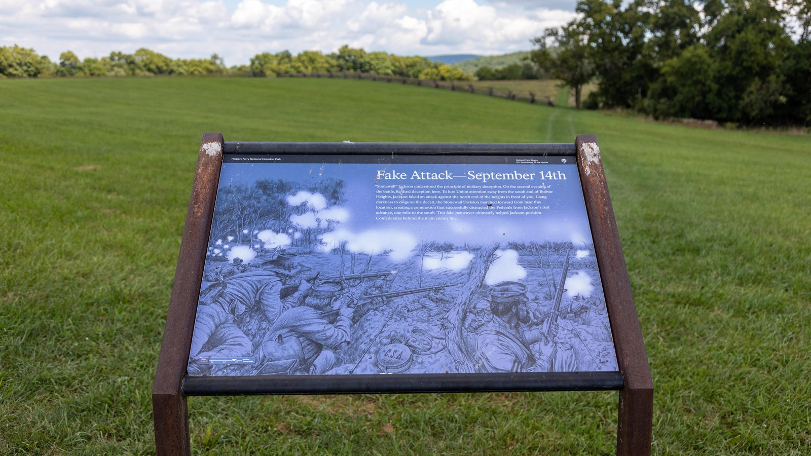 Exhibit panel in a grass field.