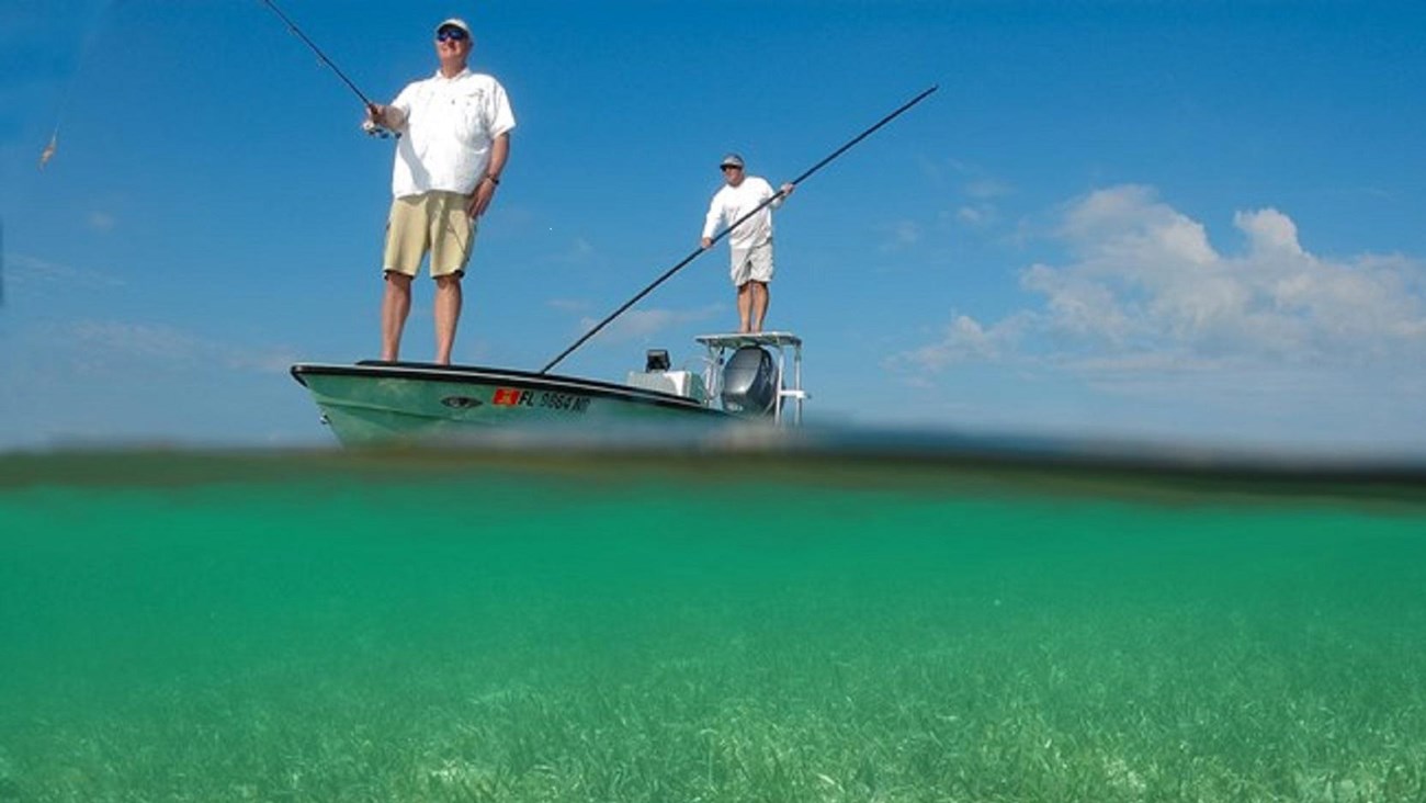 Two men fishing from a flats boat 