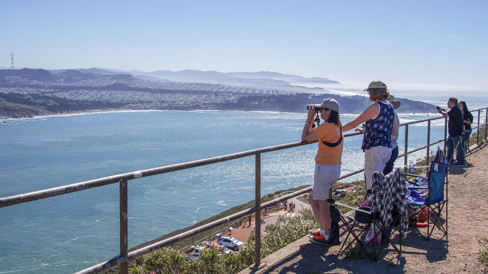 Visitors looking out to the bay from Hawk HIll. 