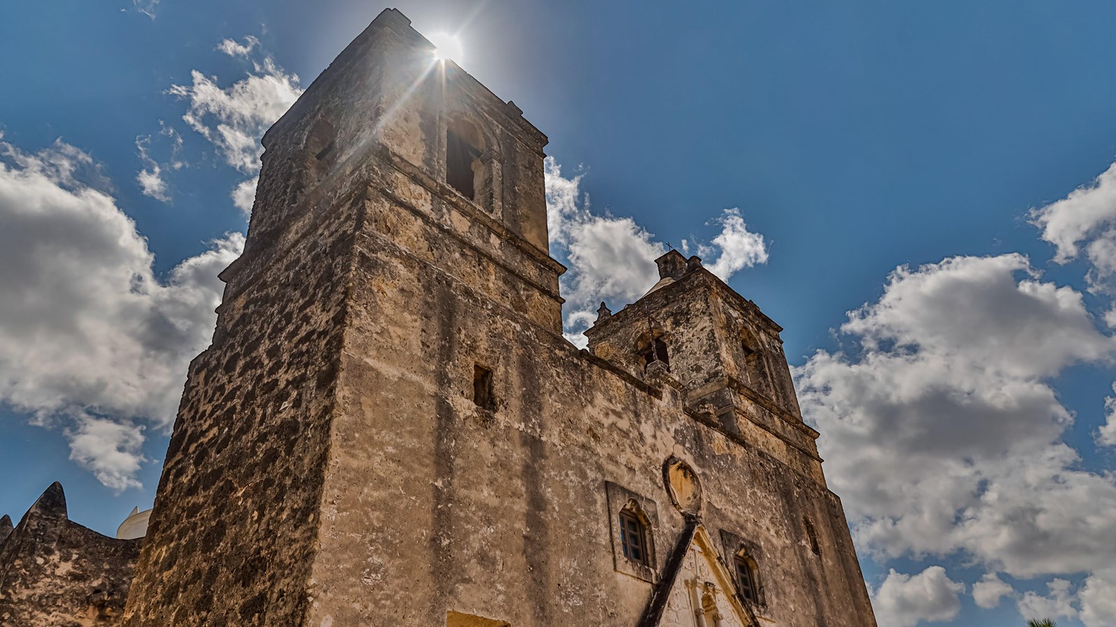 Mission Concepcion grounds with church, convento, and water well. 