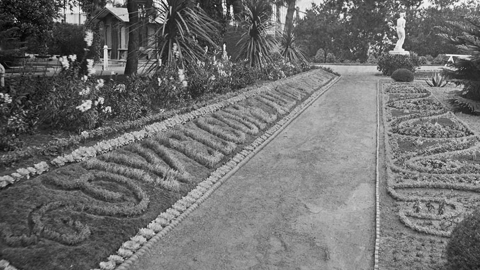 Ornately arranged plants border the path in Sutro Heights Park are trimmed to spell,