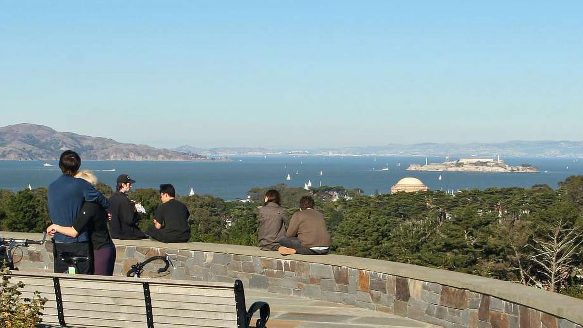 Visitors look out from inspiration point. Alcatraz Island and the Palace of Fine Arts can be seen.