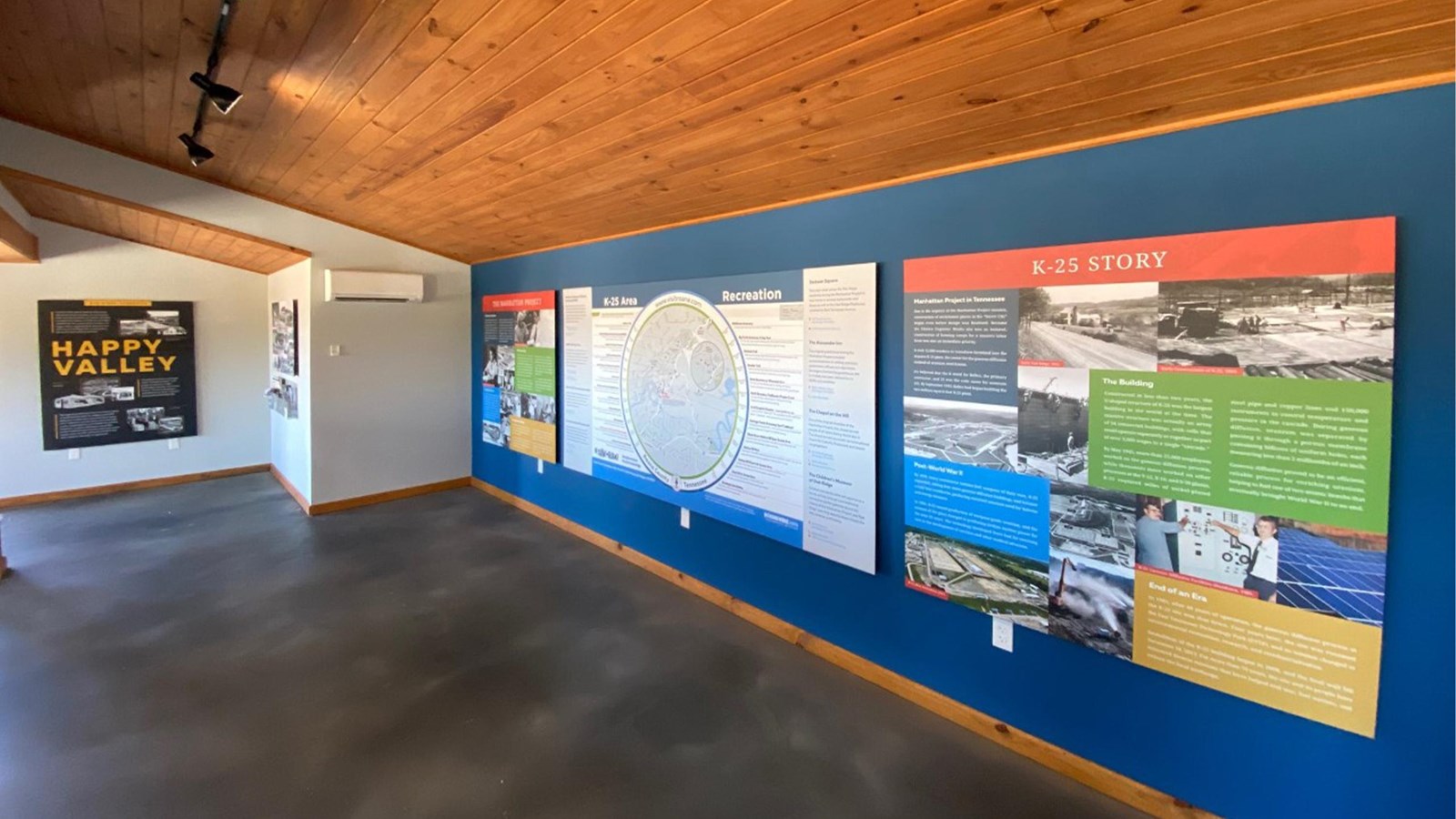 Interior of a small museum with exhibit panels along the walls.