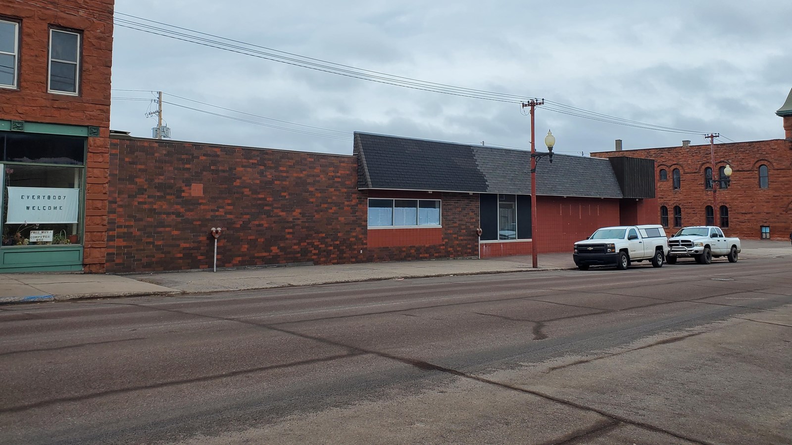 Single story red brick building with flat roof.