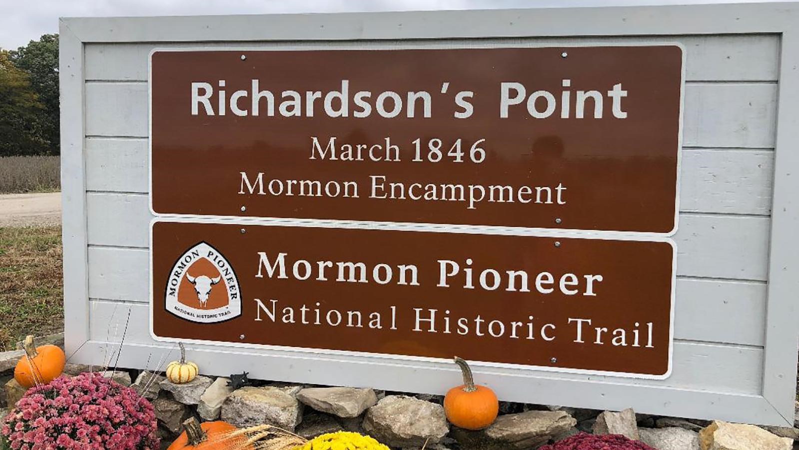 A large brown entrance sign,
