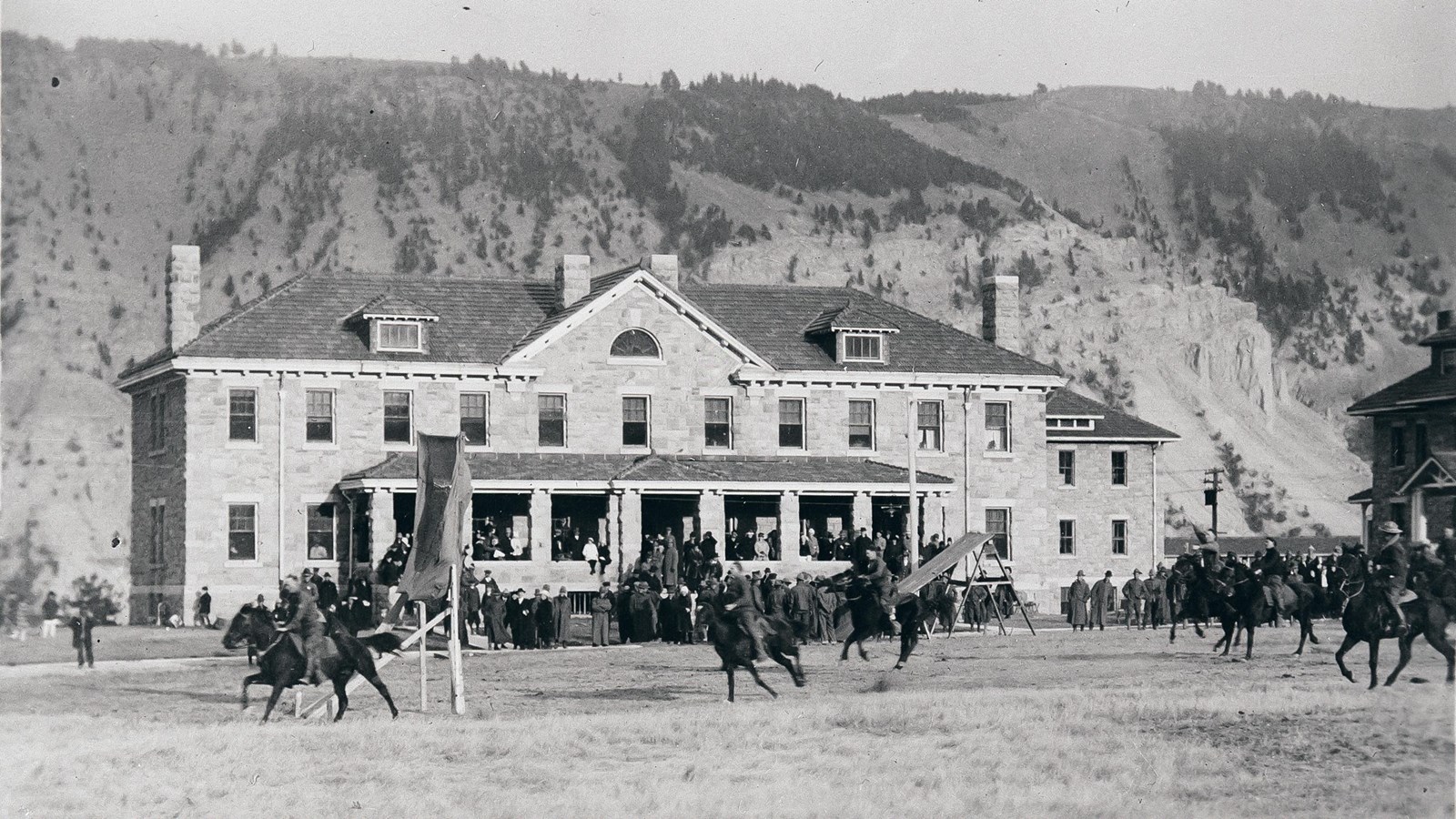 Historic photo of soldiers drilling in front of Bachelor Officers\' Quarters.