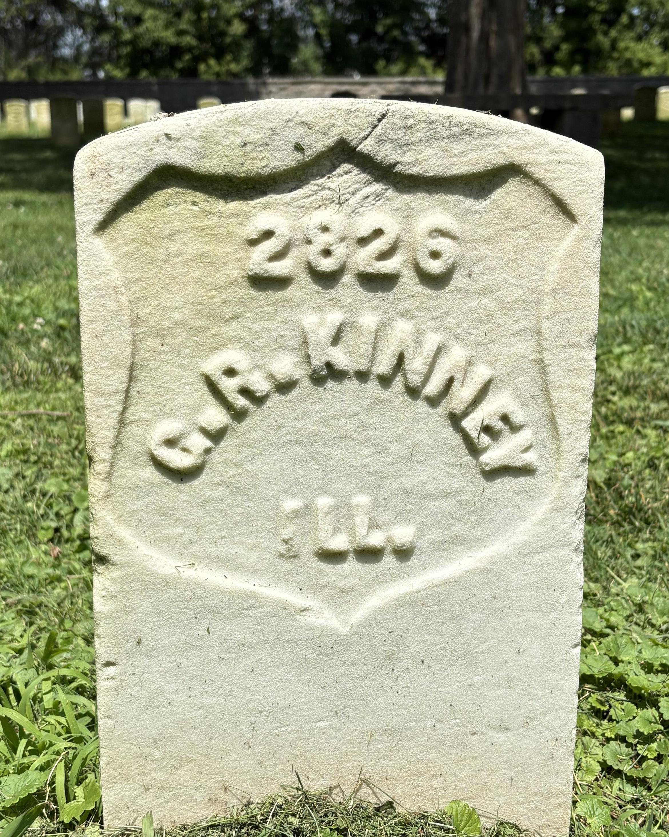 Marble headstone belonging to George Kinney. 
