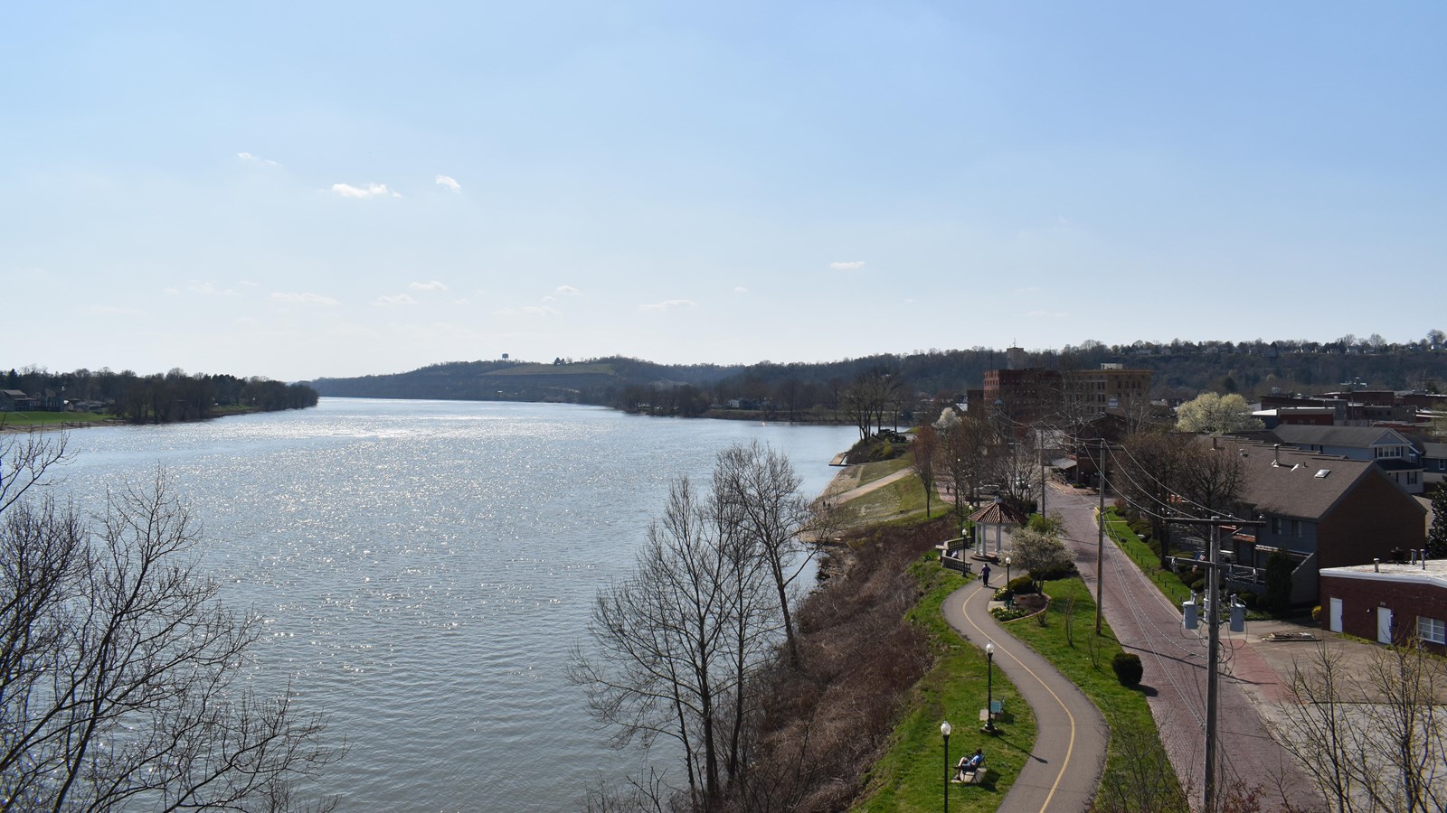 This photo captures a sweeping view of the Ohio River at Marietta, Ohio, taken on a clear day with b