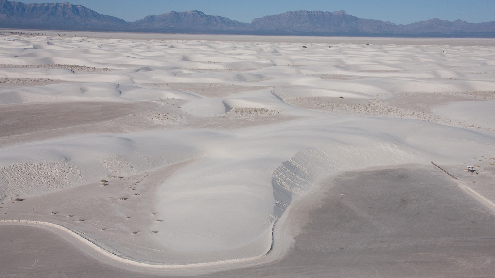 An aerial view of the Alkali Flat Trail parking lot and trailhead.
