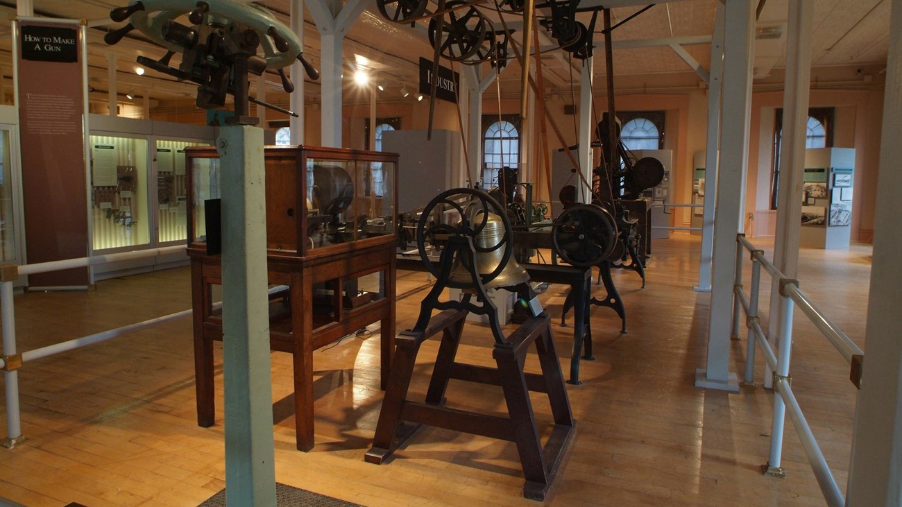 Various machines used to produce firearms in a museum.
