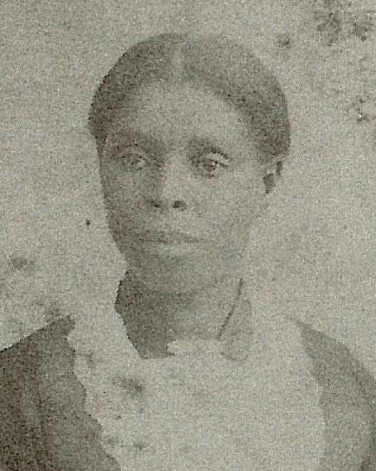 Black and White photo of African American woman from the chest up.