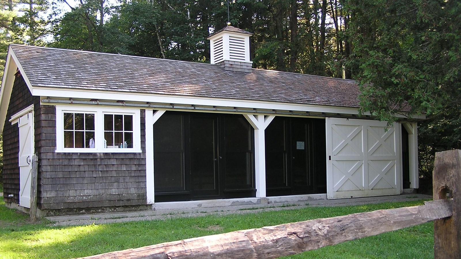 Small barn with sliding white door