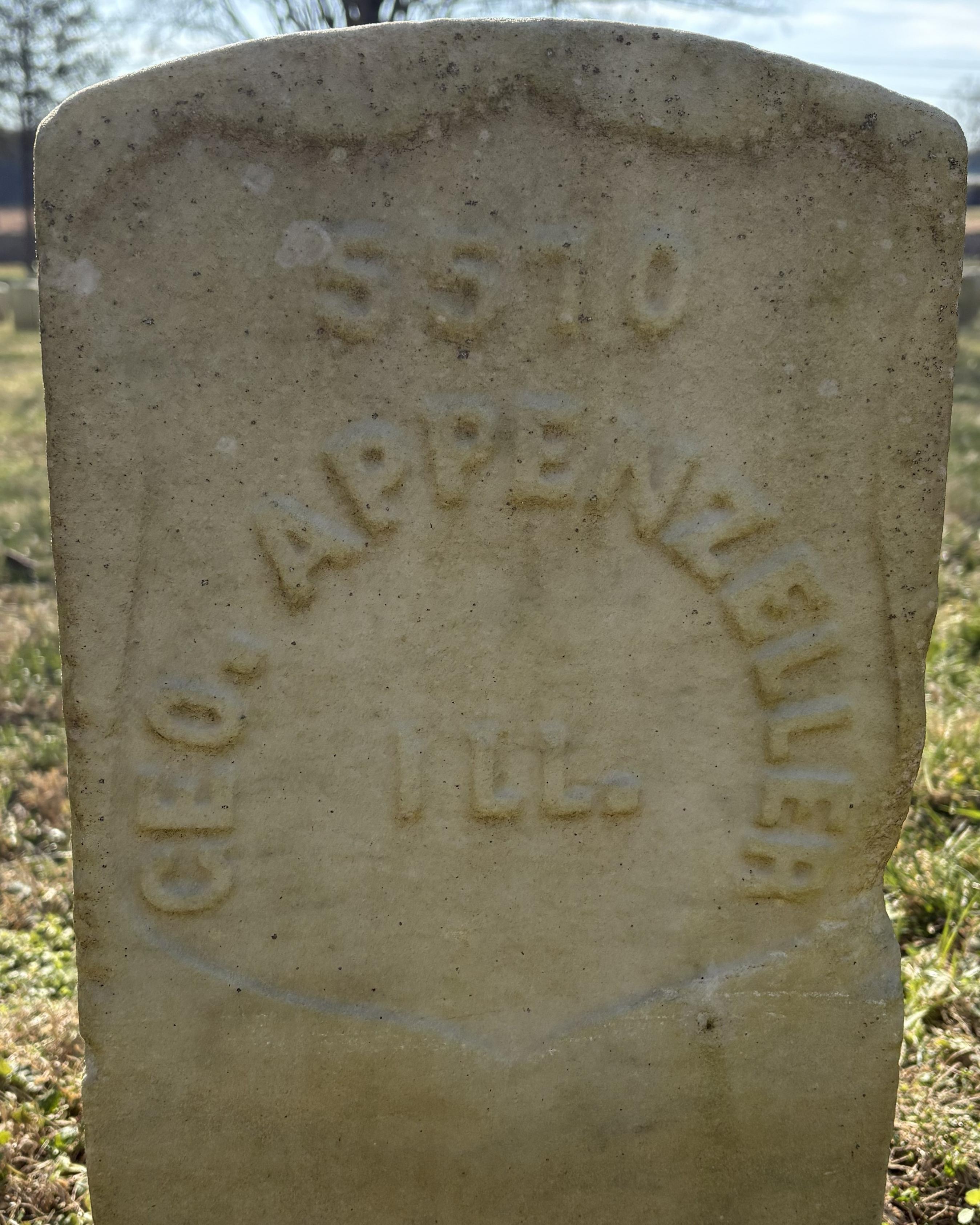 Close shot of a marble headstone. 