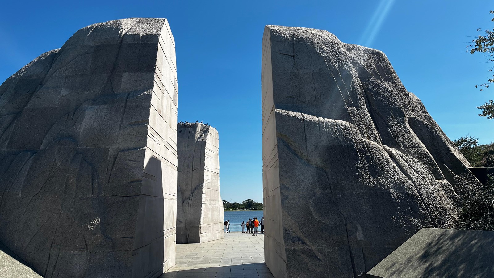 Two large white stone structures stand with an opening between them