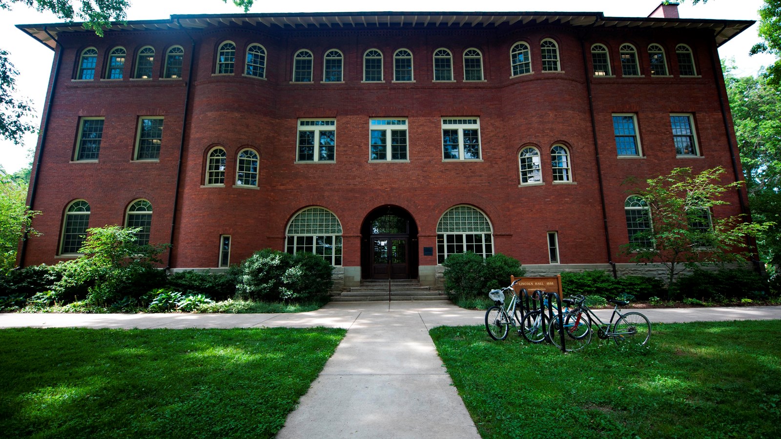 Photo of a large, several-story brick building. Photo by IMCBerea College, CC BY 2.0