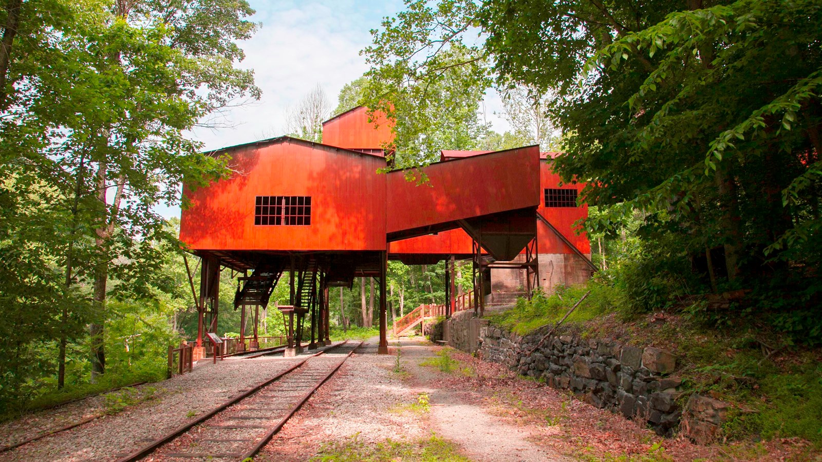 A red coal tipple standing over old railroad tracks