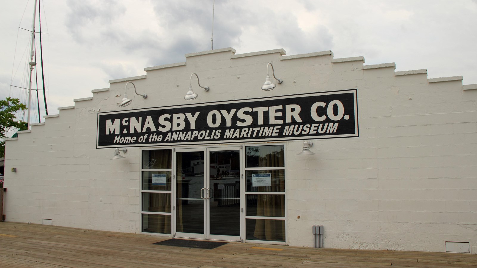 White exterior of the museum with the name of the old oyster cannery that it was home to.