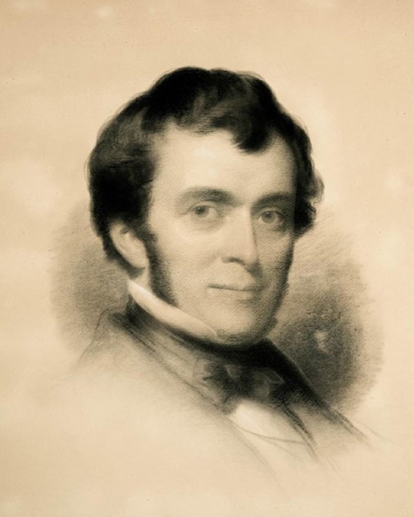 Charcoal portrait of a man with dark hair smiling.