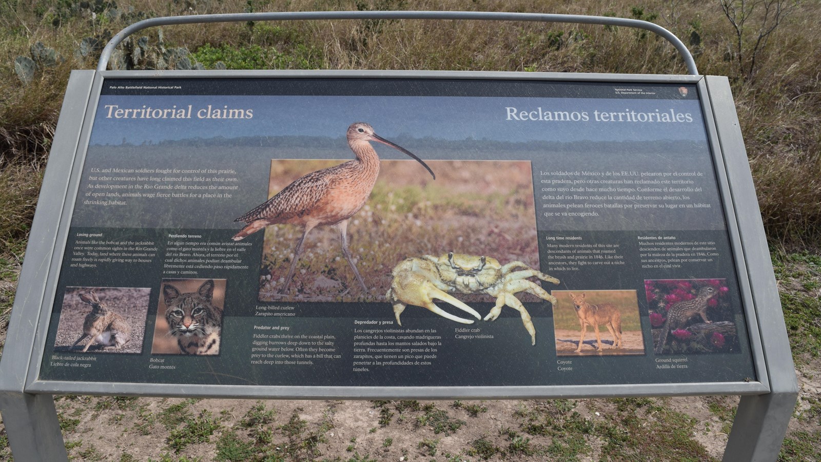 A low-profile cantilever wayside base in grey weathering steel for a 36”x 24” interpretation panel.