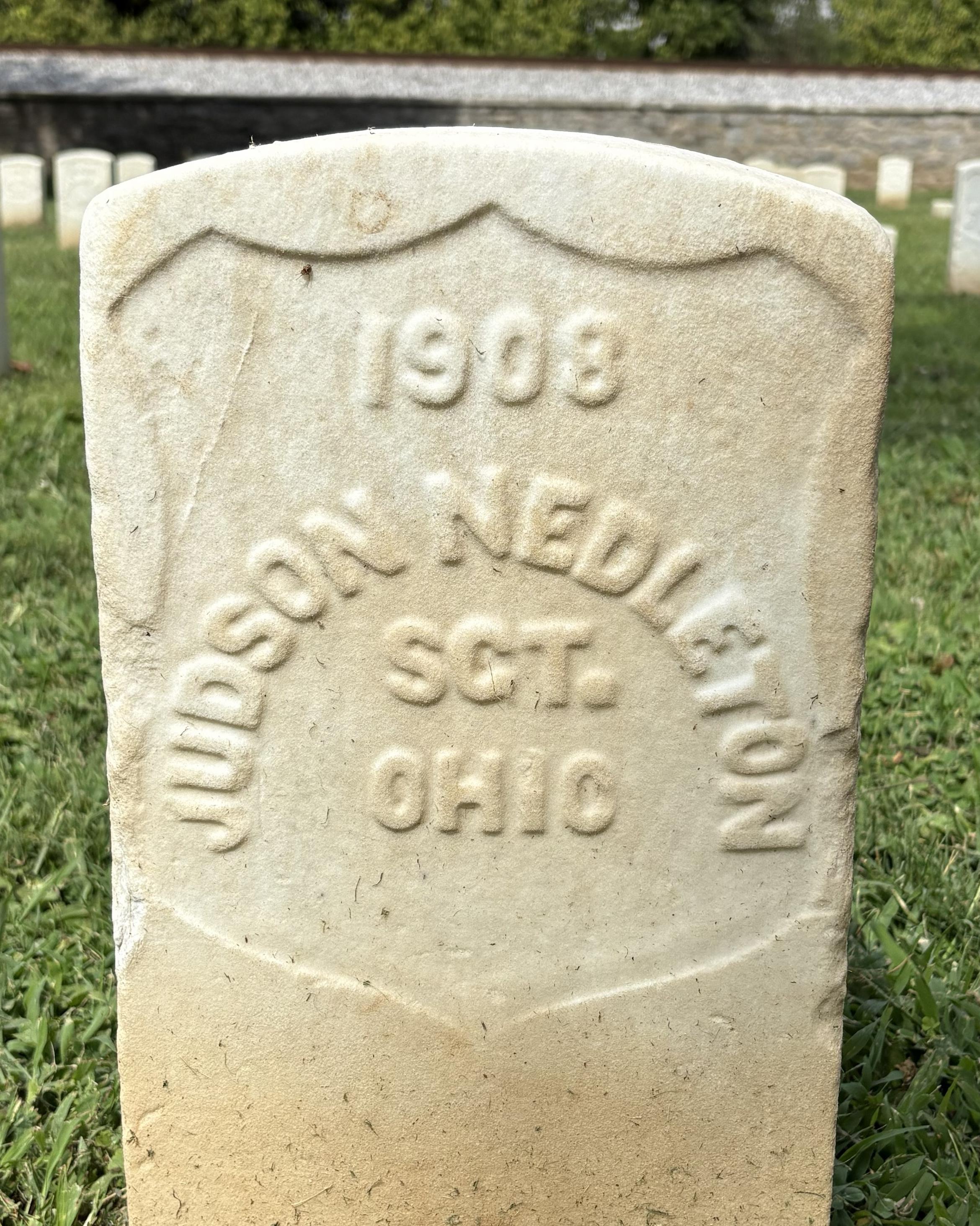 Marble headstone marking the burial site of Judson Nettleton.