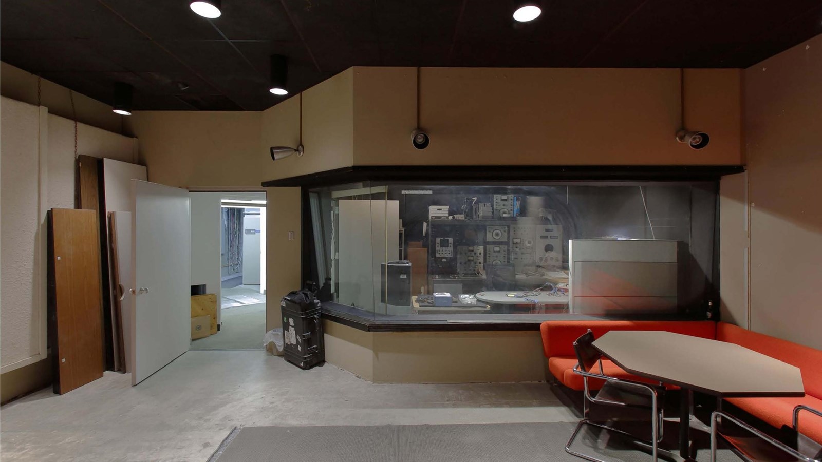 control room leading to hallway with acoustic wall panels