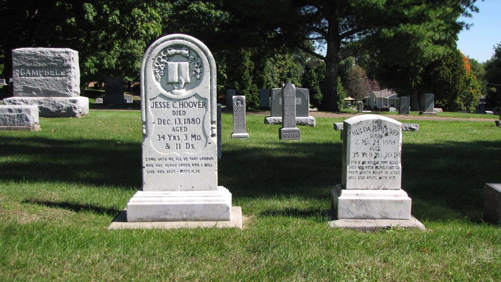 Two white headstones mark the graves of Jesse and Hulda Hoover.