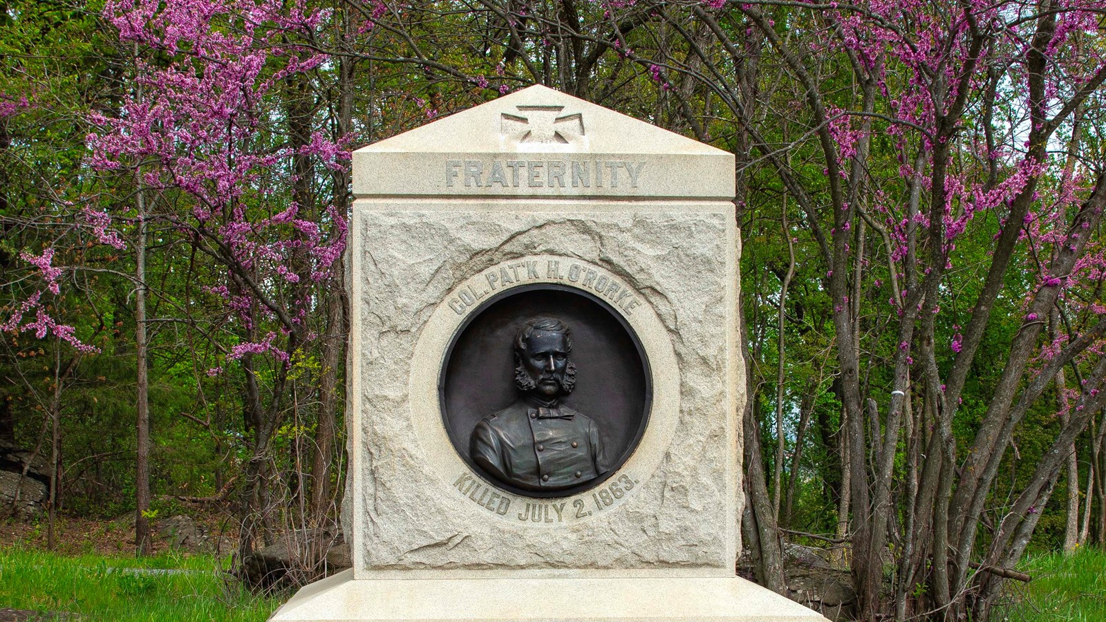 The granite monument stands just over eight and one half feet high.