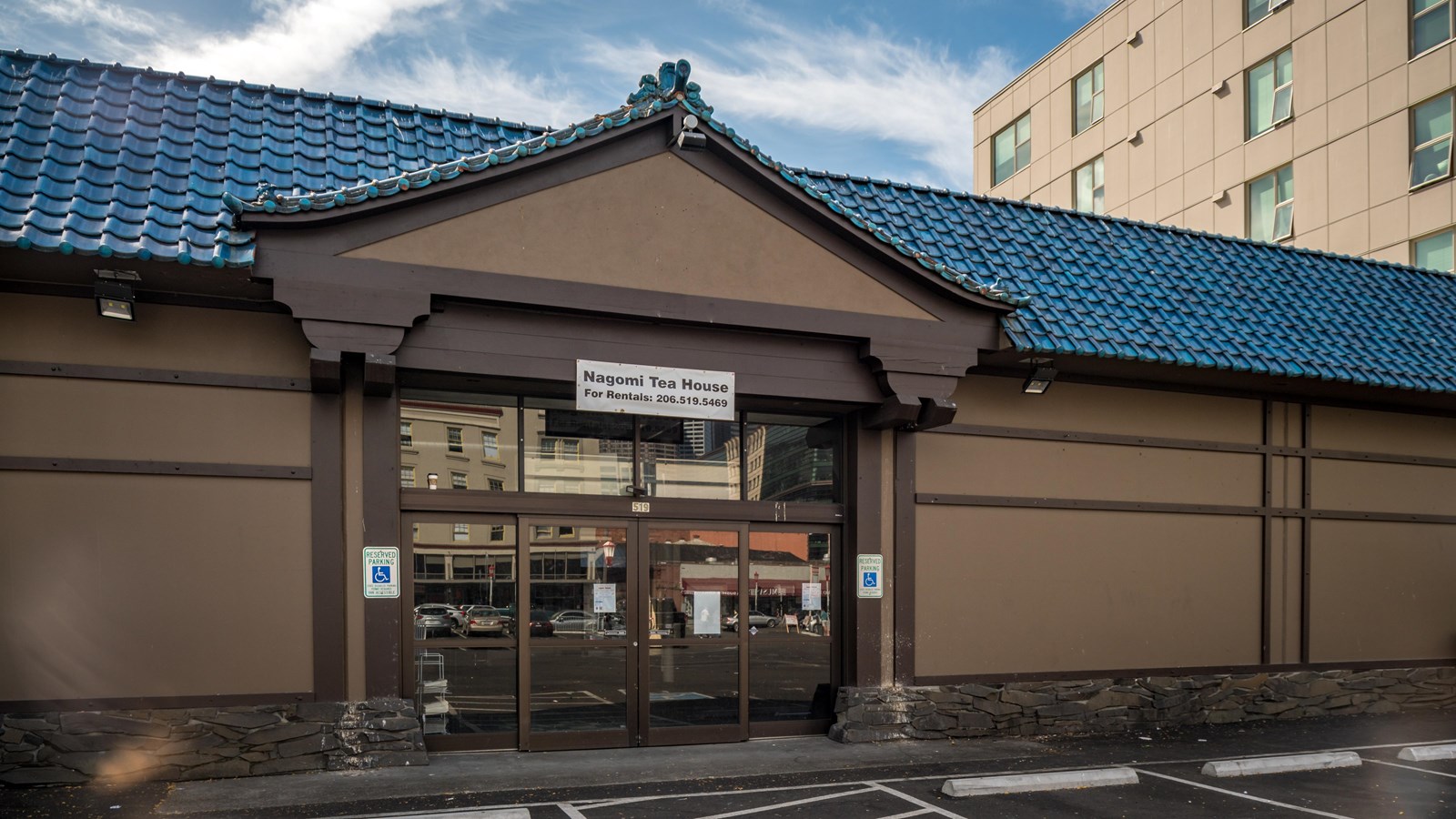 With a visually striking blue-tiled roof the building blends traditional with modern.