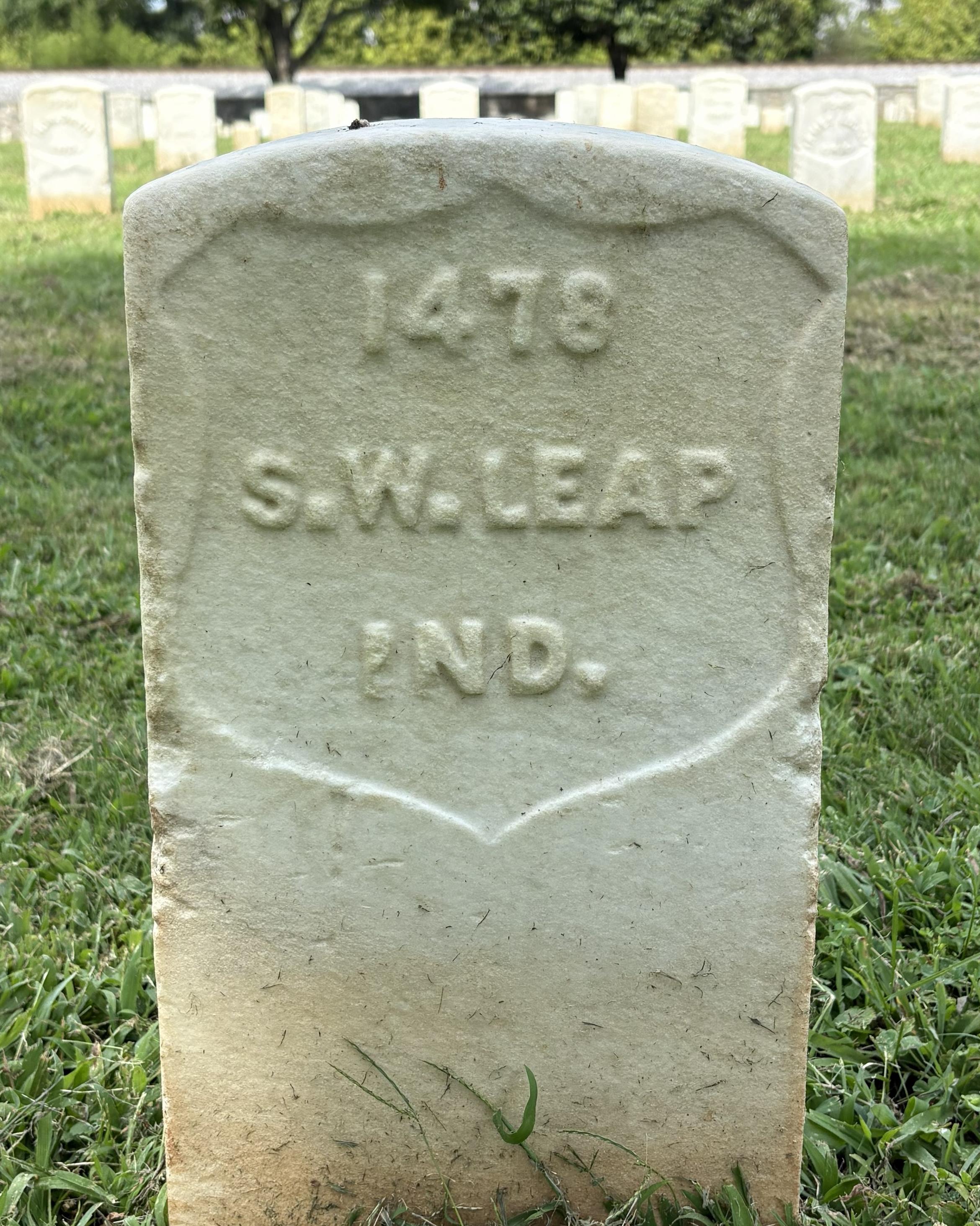 Marble headstone with the name "S Leap" on its face. 