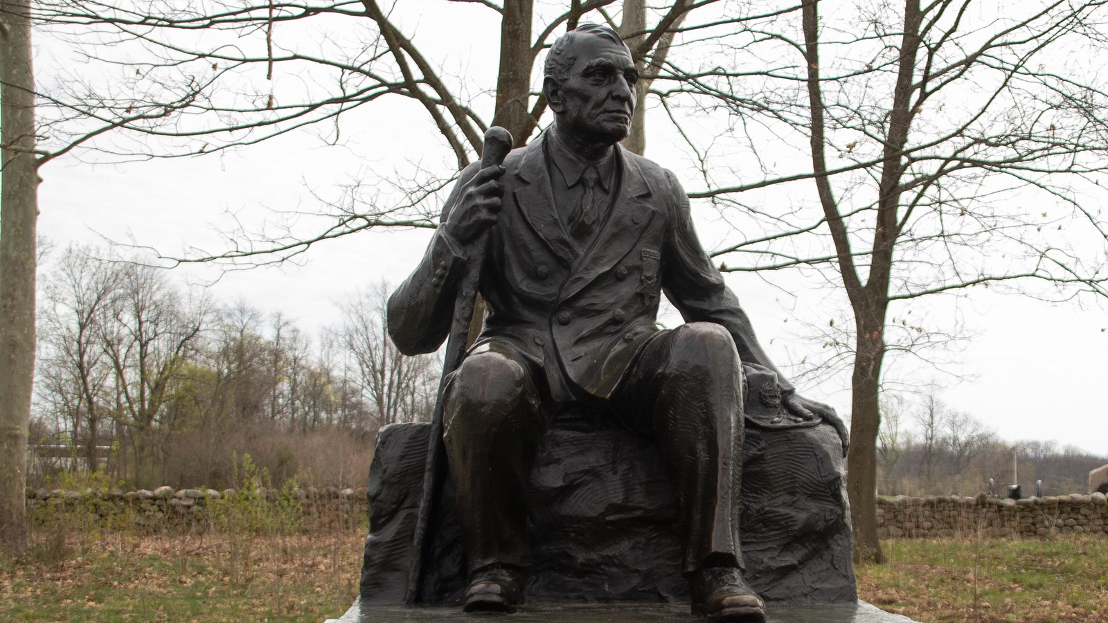 Bronze statue of last surviving member of the Grand Army of the Republic in a seated position.