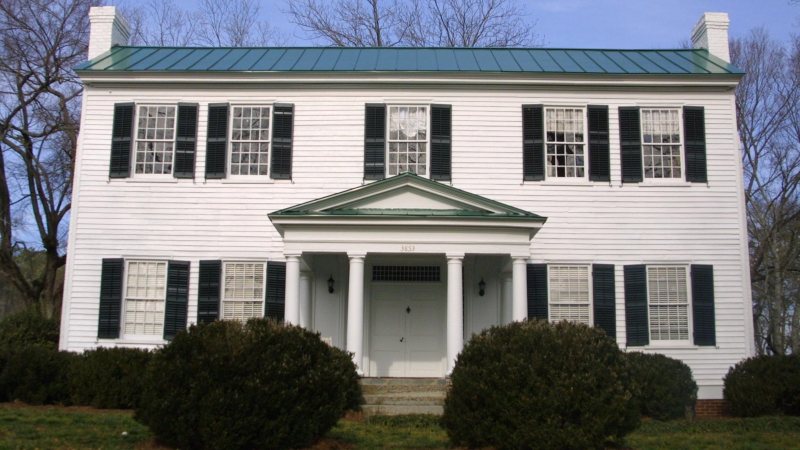 Exterior white two story mansion, owned by John Ridge prior to removal