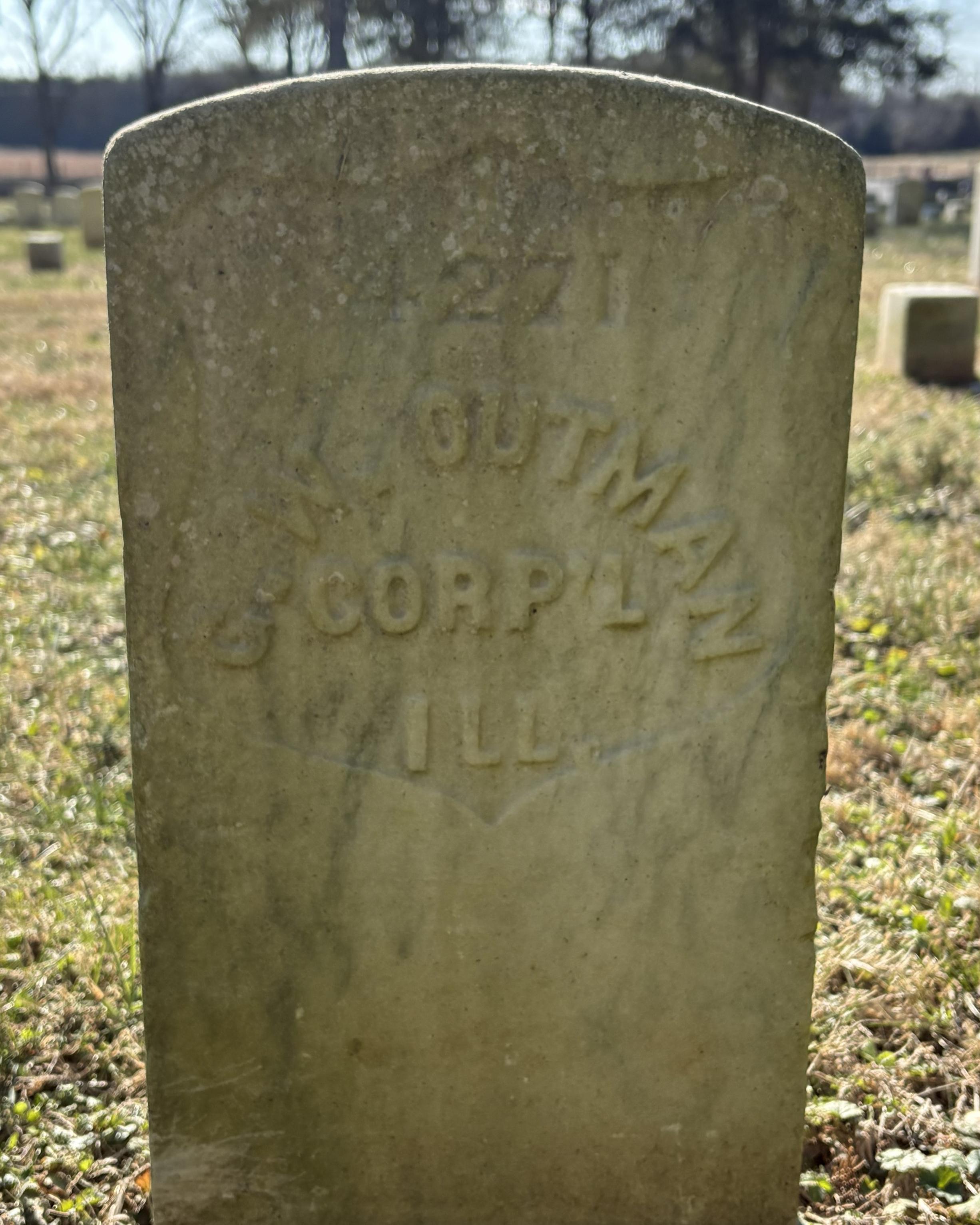 Marble headstone that reads "GW Outman."